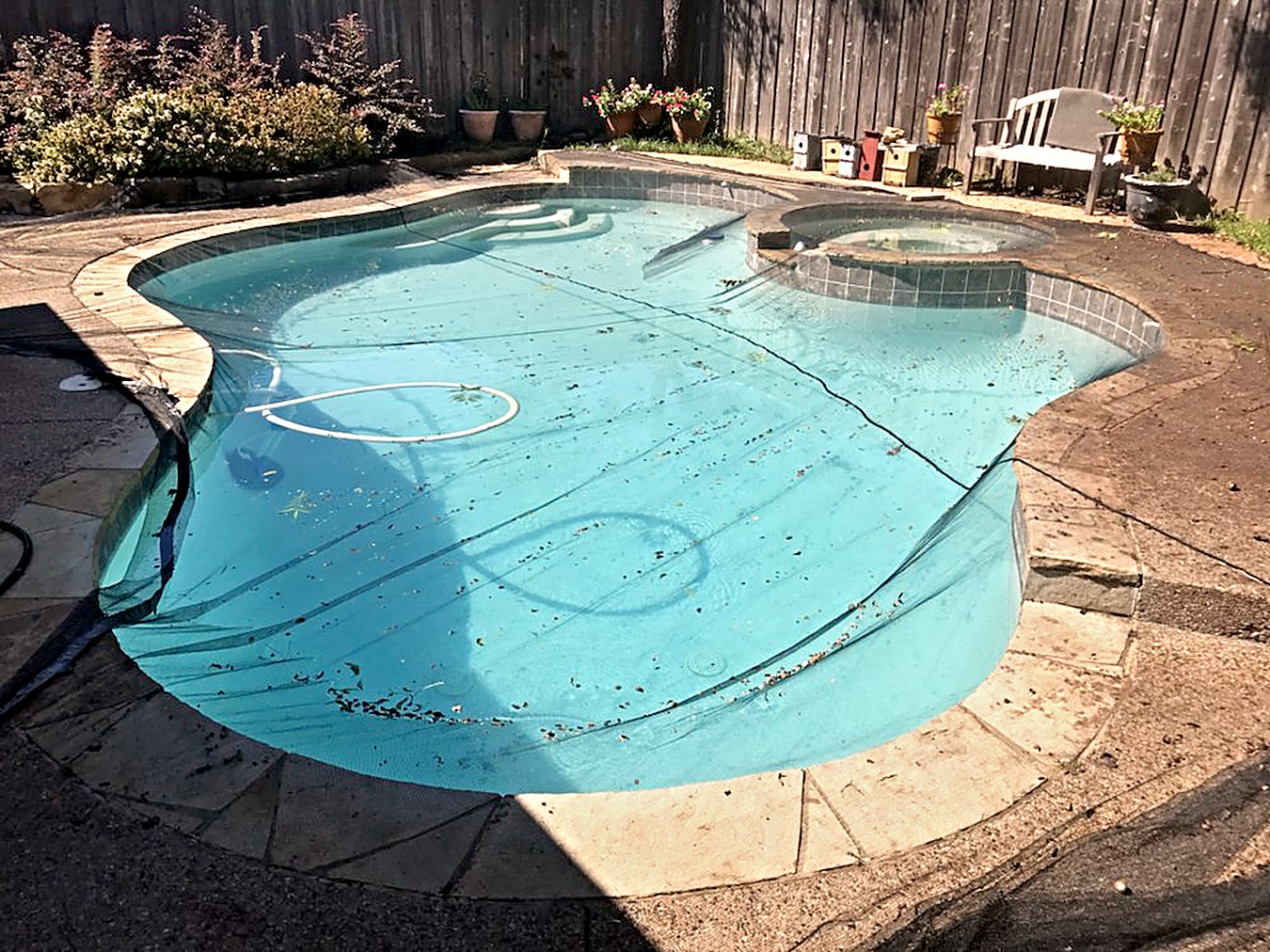 Before: safety cover and debris removed ahead of resurfacing